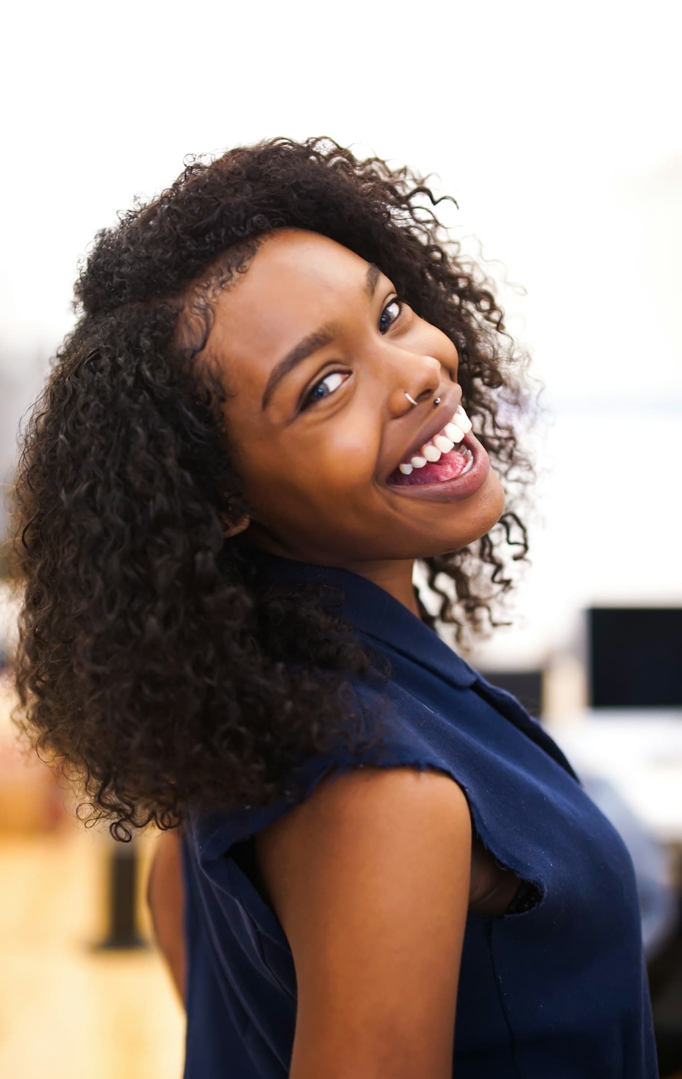 A professional smiling in a bright office